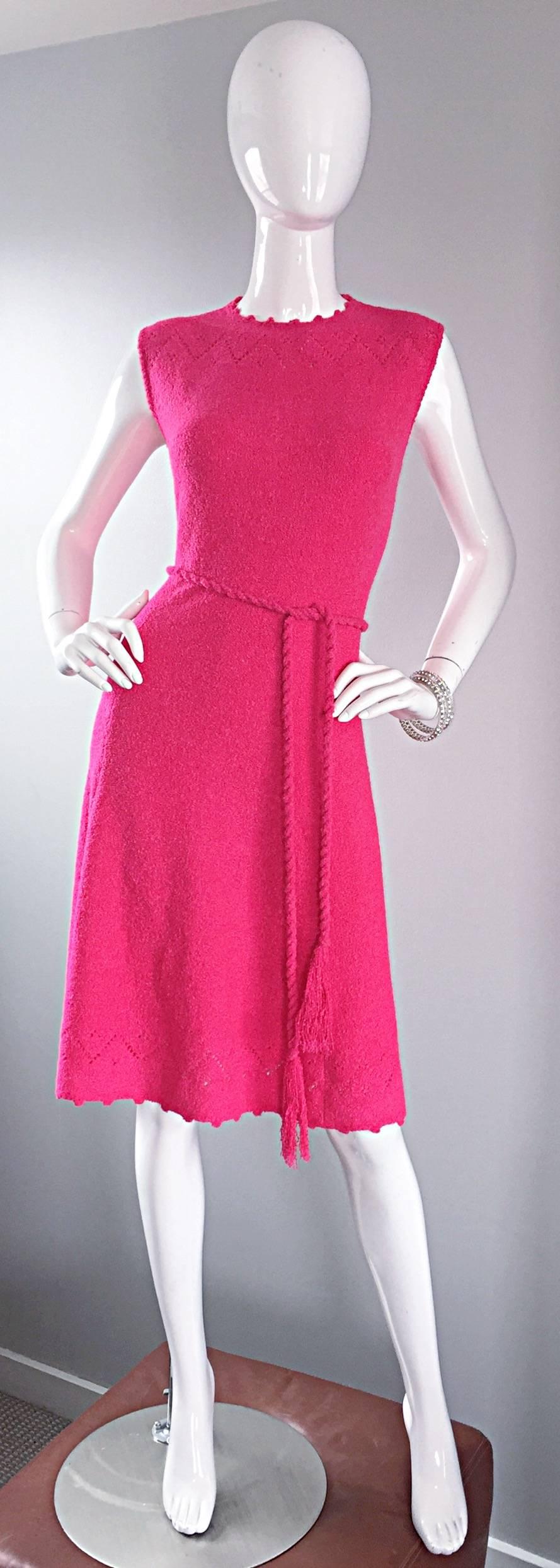 Hands down the most chic vintage 1960s ST. JOHN hot pink / fuchsia knit       A-Line dress! Features crochet detail at neck and at hem. Detachable matching tassel belt. Hidden zipper up the back with hook-and-eye closure. Super soft knit feels so