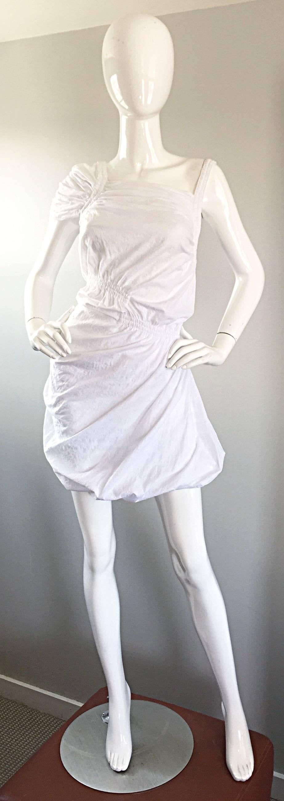 Brand new THAKOON white cotton asymmetrical mini dress! Purchased from SAKS in San Francisco for $1,550--Never been worn! Luxurious soft cotton, with elastic at waist, shoulder and hem. Features one cap sleeve and one sleeveless strap. Hidden zipper