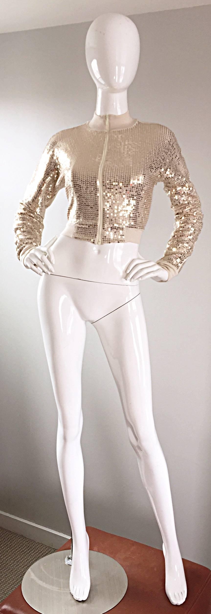 Fabulous FLAVIO CASTELLANI gold sequin 'disco ball' crop jacket! Features all over hand-sewn gold sequins throughout. Soft viscose stretches to fit. Fully lined. Never worn. Great with jeans, shorts, a skirt, or over a dress. In great unworn