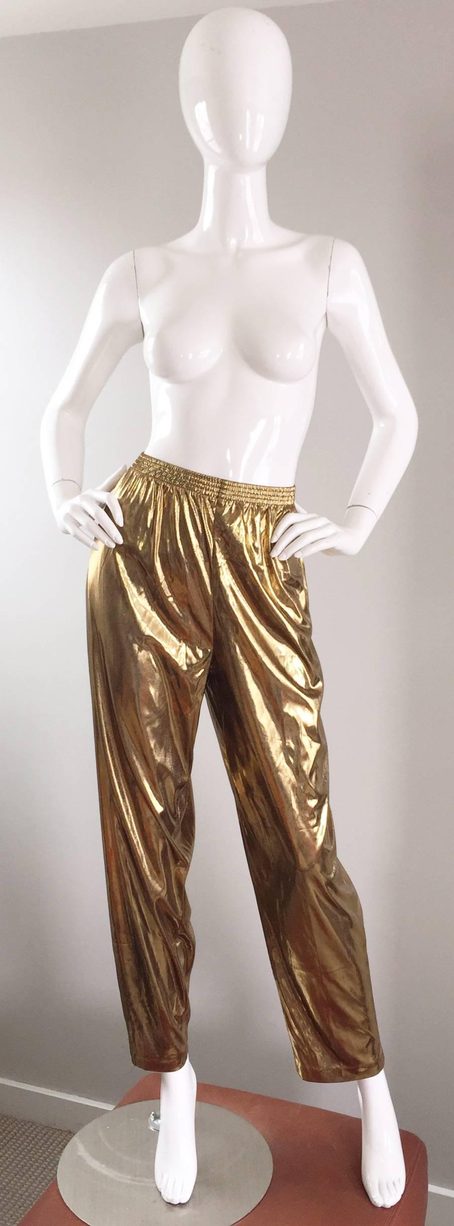 Fantastic vintage gold lame Lori of California trousers! What else can I say besides AWESOME?!? Brand new with original tags. Features an elastic waistband to accommodate an array of sizes. Pockets at both sides of the waist. Can easily be dressed