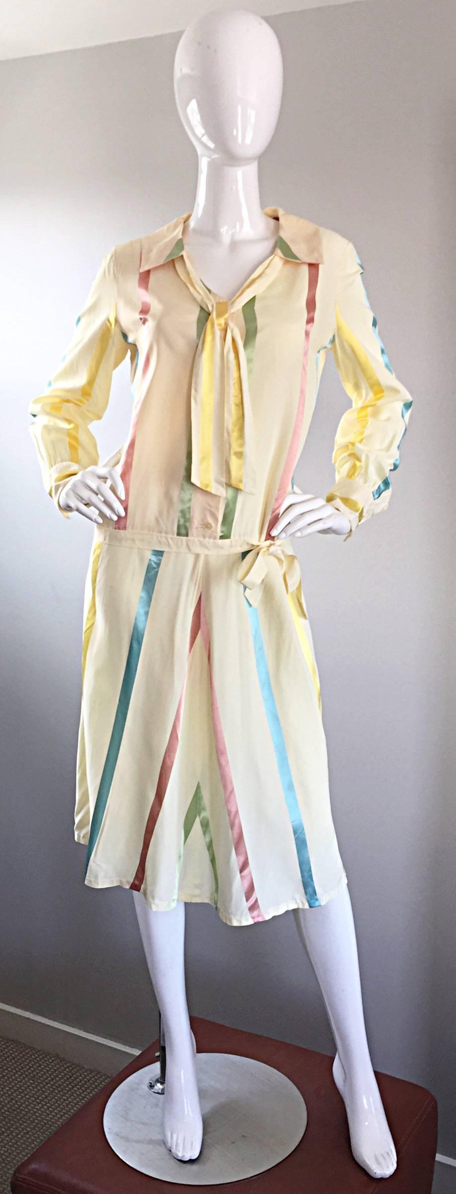 Incredibly chic 1920s 20s silk vintage dress! Classic drop waist style with a side bow at the waist. Tie at neck. Ivory silk with pastel blue, pink, yellow and green vertical stripes throughout. Fantastic 