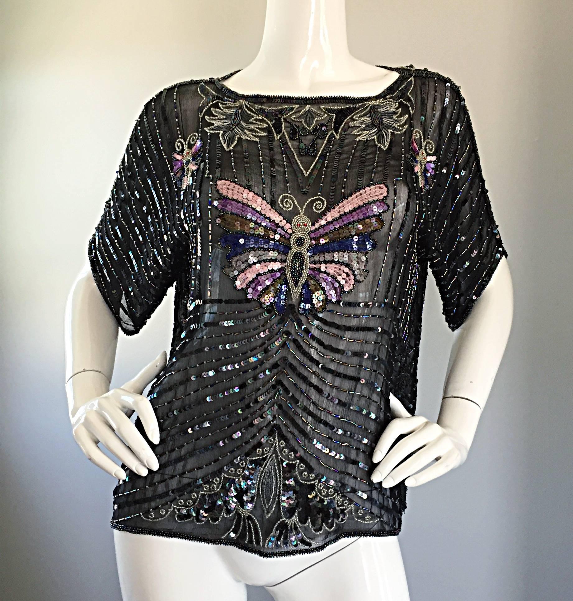 Amazing and rare vintage JEANETTE KASTENBERG for ST MARTIN black silk beaded and sequin butterfly top! Features thousands of hand-sewn sequins and beads throughout the entire blouse. Semi sheer luxuriously soft silk. Slouchy fitted look can work for