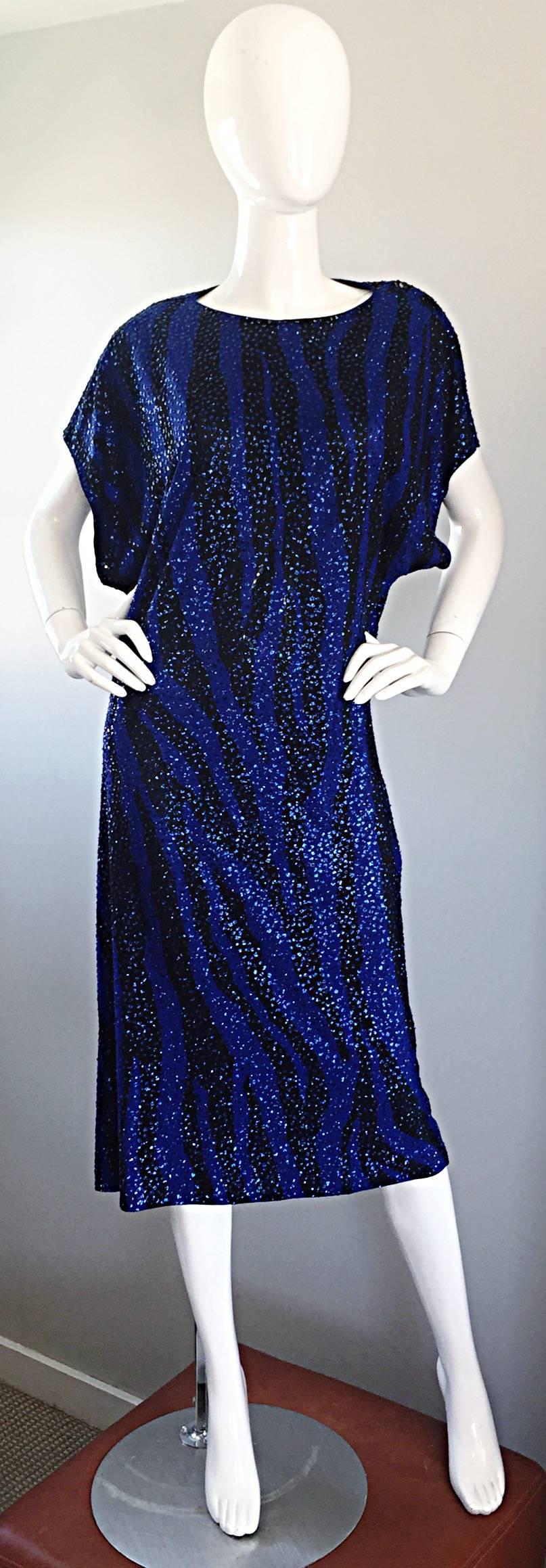 Incredible vintage 1970s NEIMAN MARCUS royal blue and black zebra / animal print GLITTER caftan dress! Features an awesome zebra print, with 'glitter' dots scattered throughout. The glitter was expertly attached, and literally none came off when I