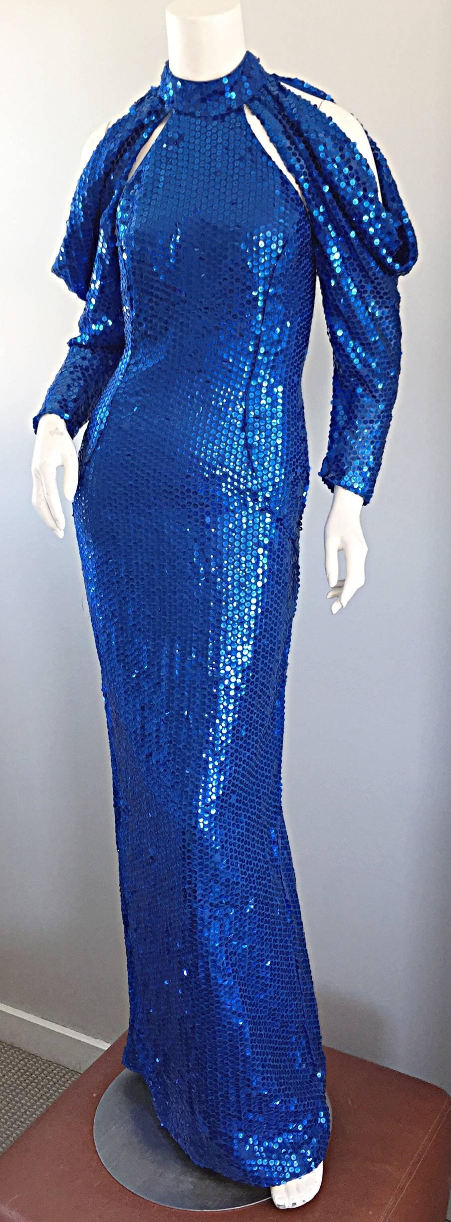 Sexy vintage 1970s royal blue fully sequined silk dress! Features multiple cut-outs above the bust, and at each shoulder. Flattering open back reveals just the right amount of skin. Amazing construction, with heavy attention to detail. Hidden zipper