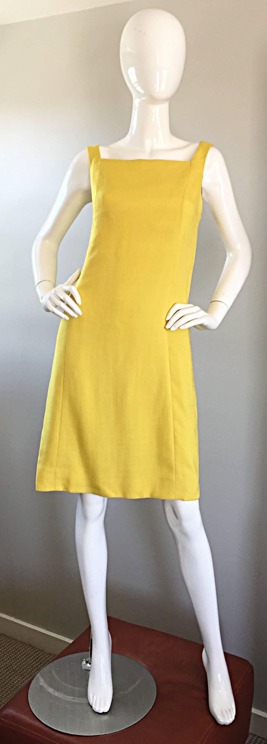 Chic 1960s PAUL STANLEY New York canary yellow linen shift dress! Luxurious Irish linen that is partially lined. Flattering A-Line / Twiggy shape works for a variety of body types. Two buttons at the back sleeves add just the right amount of detail.