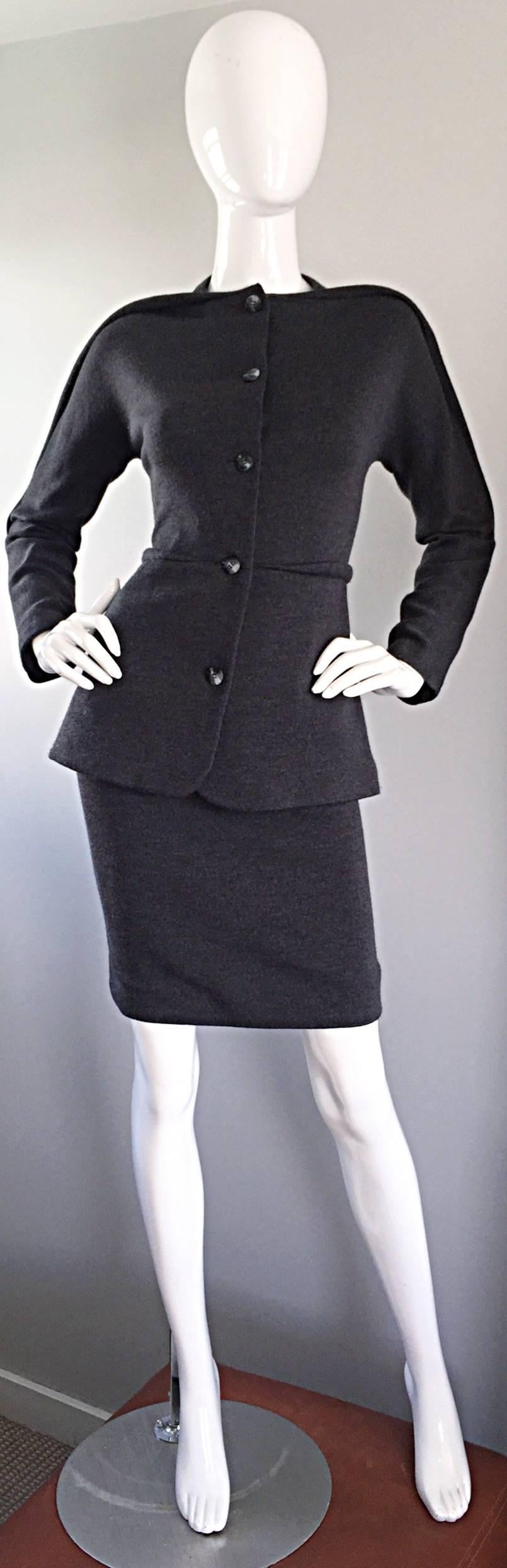 Important vintage 90s GEOFFREY BEENE charcoal grey skirt and jacket suit! Iconic 'piping' along the shoulders of the blazer, and at center waist. Buttons up the bodice. High waisted mini skirt. Hidden zipper up th eback with hook-and-eye closure.