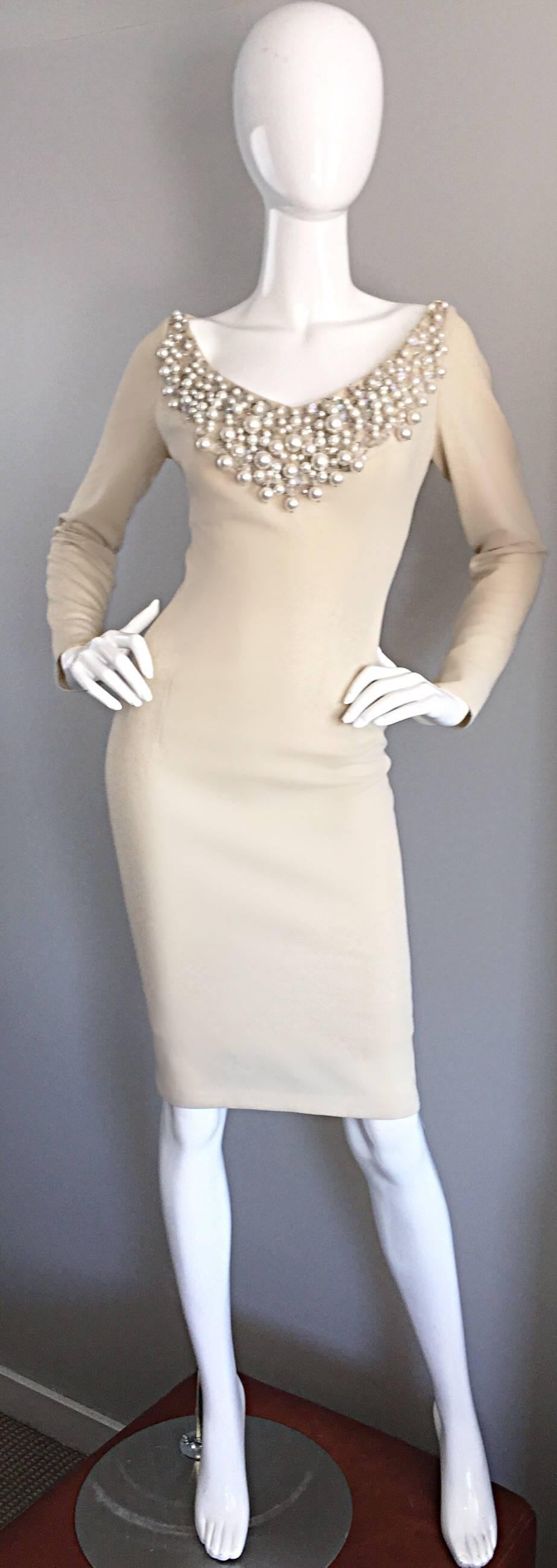 Exceptional vintage 60s SYDNEY NORTH beige crepe jersey wiggle dress! Features hand sewn oversized pearls, sequins and beads at the front bust, acting as a chic collar. Flattering body hugging fit looks fantastic on an array of shapes. Sleek long