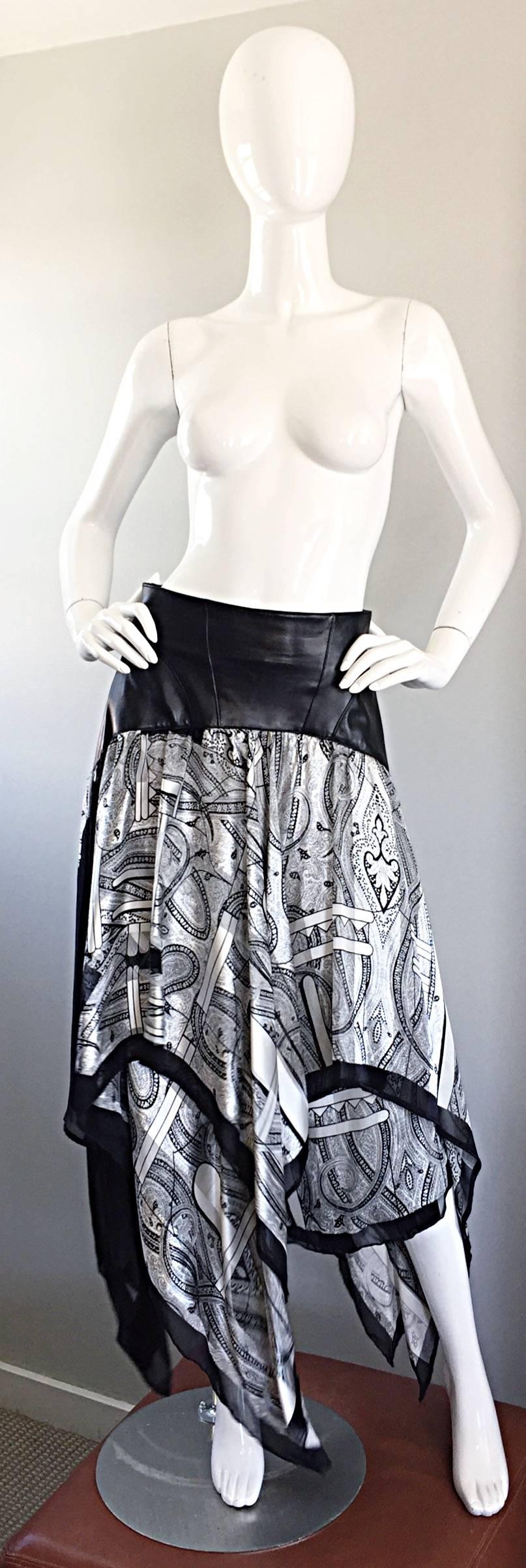 Amazing 1990s / 90 JEAN CLAUDE JITROIS Couture (Numbered) leather and silk asymmetrical handkerchief skirt! Body hugging soft leather at top, with layers and layers of black and white silk paisley print. Hidden zipper up the back with hook-and-eye