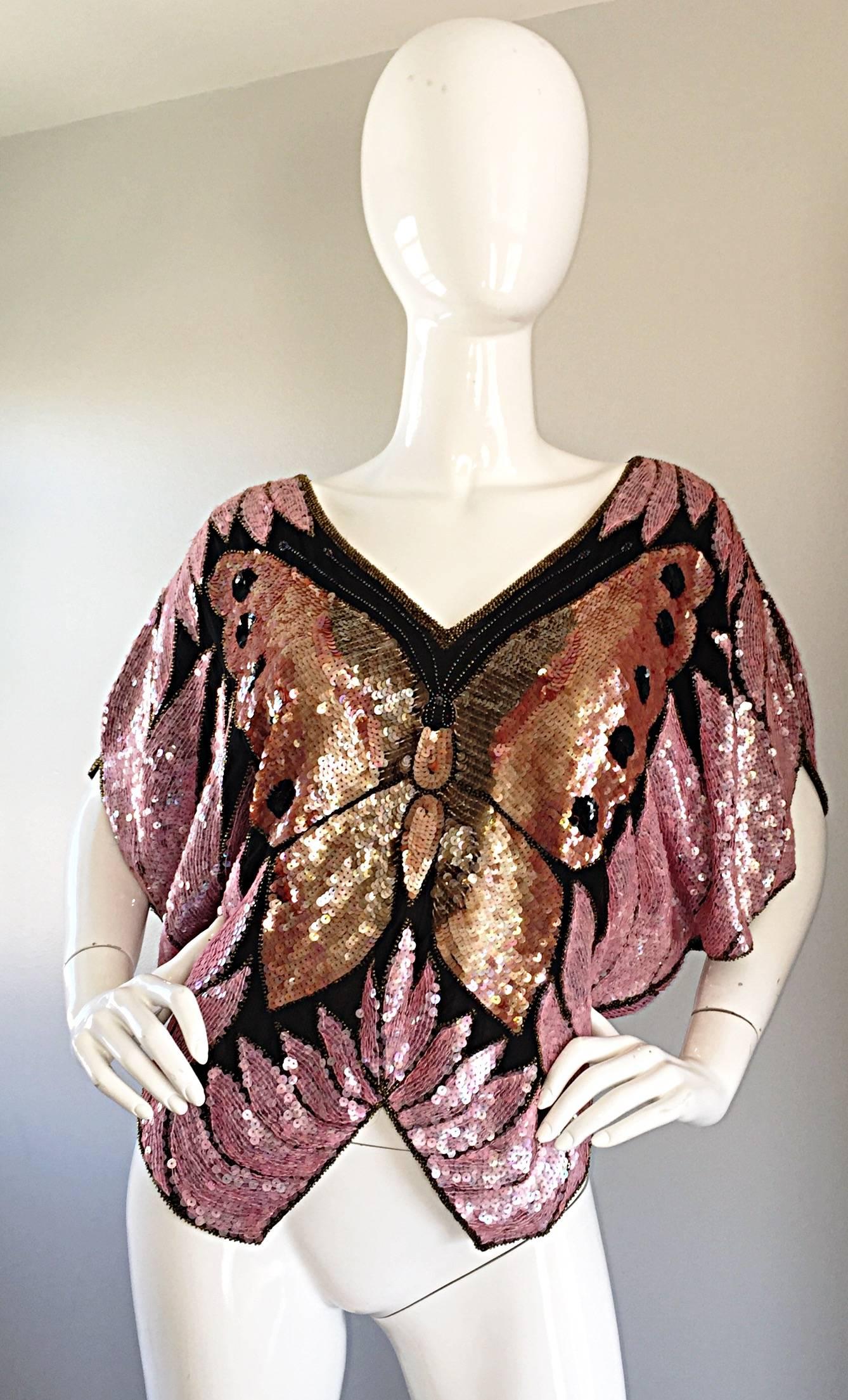 Amazing fully sequin and beaded 70s SWEELO butterfly disco dolman sleeve silk blouse! Fully hand-sewn and beaded, with gold and pink sequins that form a butterfly on the front and back. Chic dolman sleeves make this gem easy to fit most sizes. Hangs