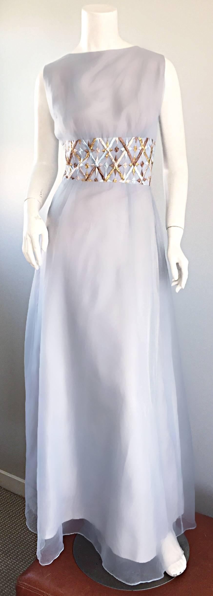 Sensational 1960s MELBRAY OF LONDON light blue silk and chiffon gown! Couture quality, with heavy attention to detail. Features a flattering gold, silver and blue hand embroidered waistband. Pale blue silk underlay with an attached pale blue chiffon