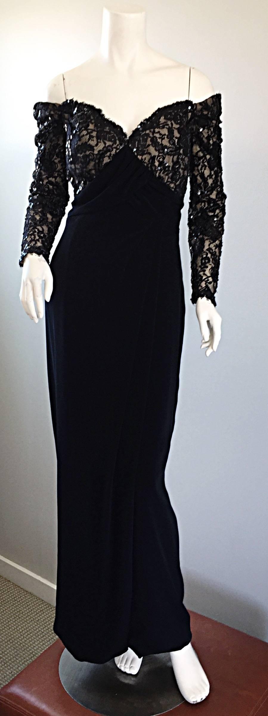 The perfect vintage 90s BOB MACKIE black evening dress! Features a fitted boned lace and hand-sewn sequin bodice, with off-the-shoulder sleeves. Flattering full length skirt, with draping Grecian detail at the side, and at hem. Built in interior