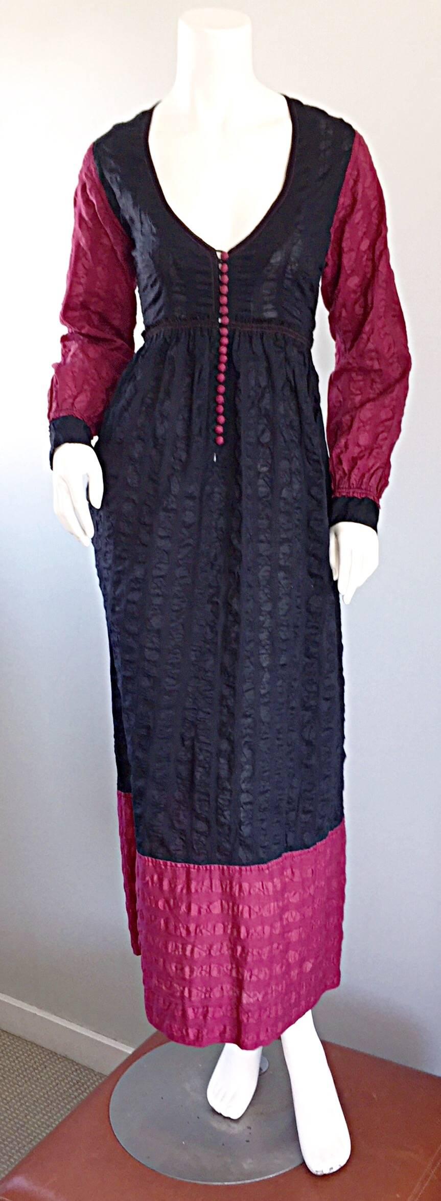 Beautiful and flattering vintage 70s JEAN MUIR long sleeve soft cotton textured empire waist maxi dress! Lightweight embroidered cotton, with a black bodice, and raspberry sleeves, hem, and buttons. Corset style bodice features 19 functional fabric