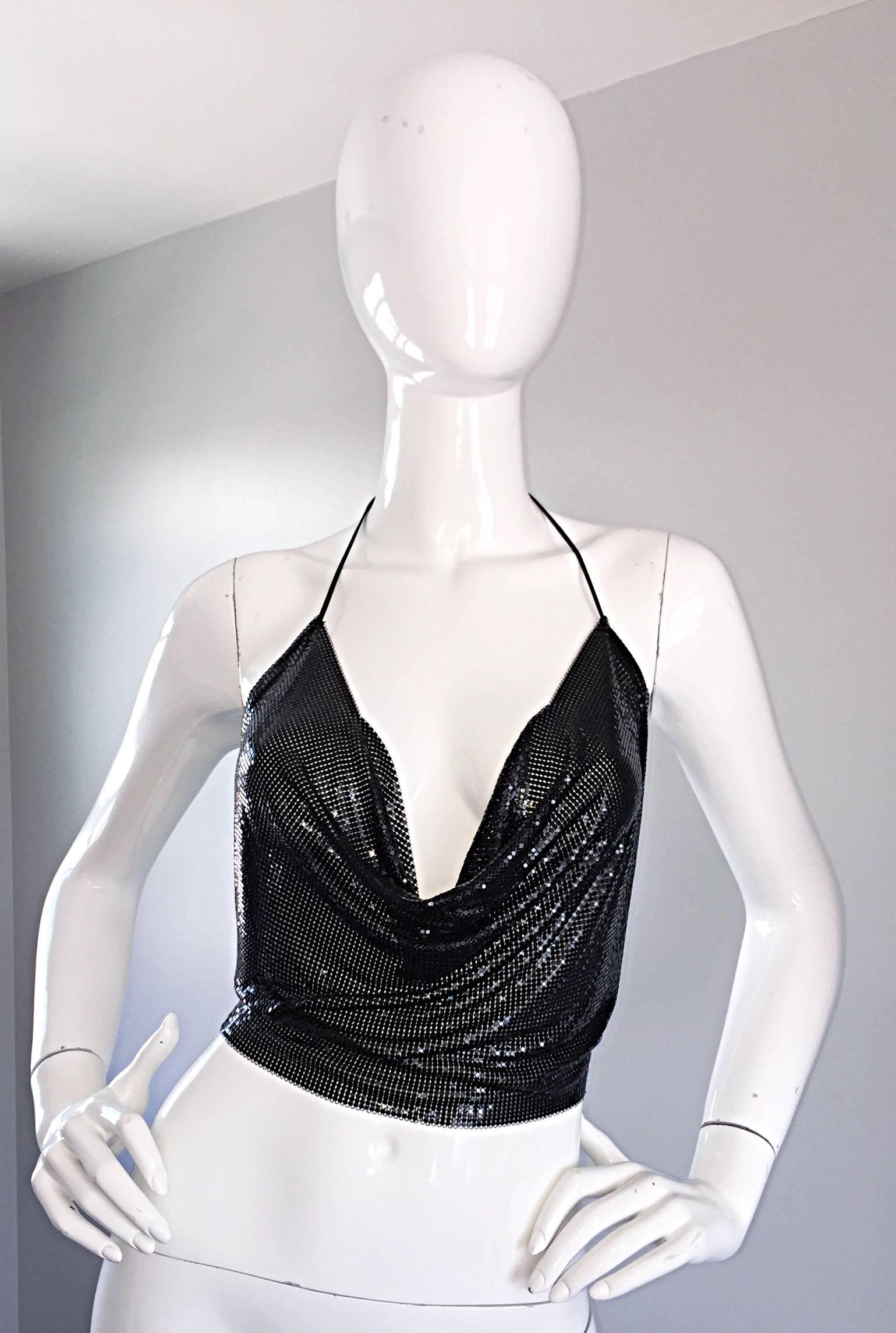 Insanely sexy 70s gunmetal/black chain mail metal disco cropped halter top! This rare gem is attributed to Paco Rabanne. As with many of Rabanne's tops and dresses that do not have chain closures, there is no brand tag, as there would be no place to