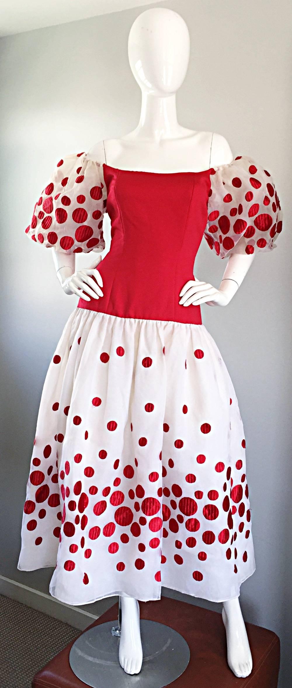 Amazing vintage VICTOR COSTA red and white polka dot Avant Garde off the shoulder dress! Features a red fitted boned bodice, with elastic trimmed sleeves that can be worn off shoulder or on the shoulder. Full flirty skirt has a 1950s feel. Layer of