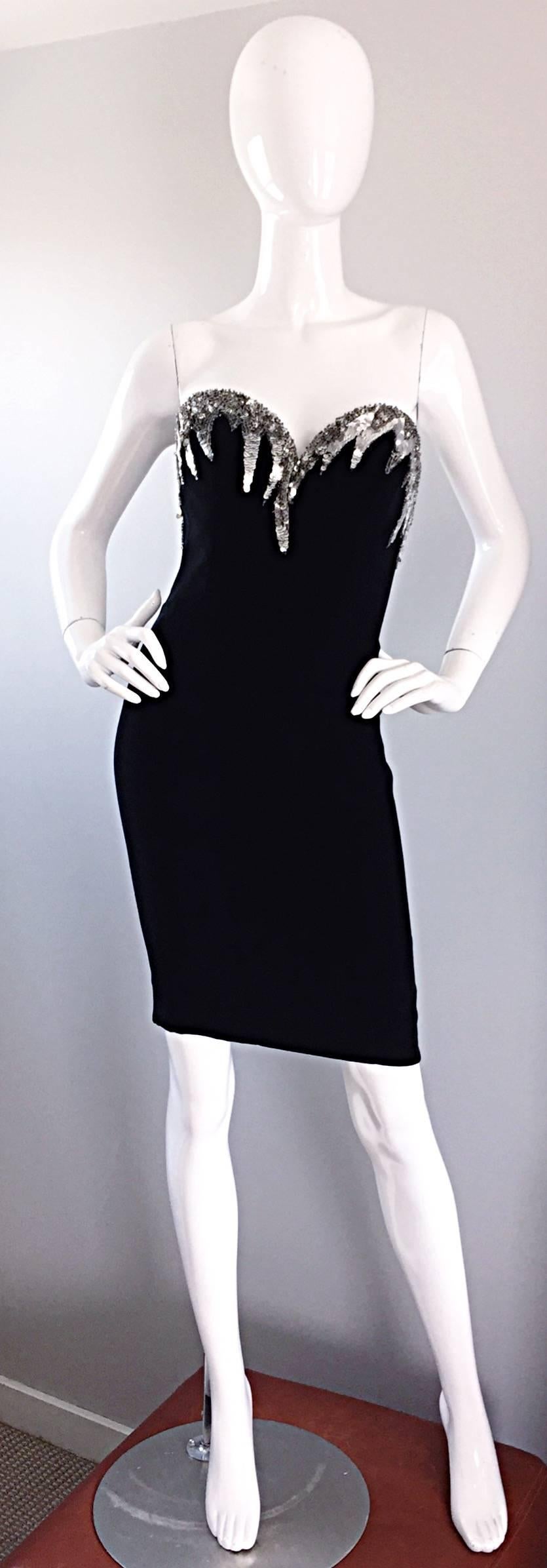 Sexy, yet sophisticated vintage BOB MACKIE black bodcon strapless dress, with silver sequins hand-sewn around the front and back bodice! Sensational fitted dress with built in support, and is boned. Fully lined. Hidden zipper up the back with