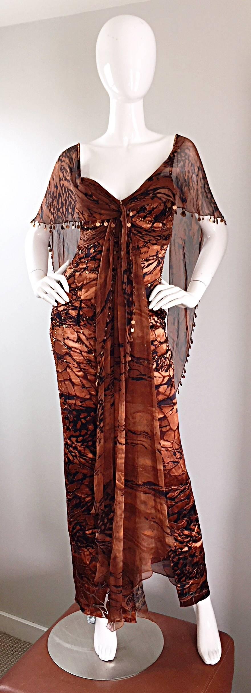 Beautiful vintage DIANE FREIS 1990s silk chiffon flutter boho gown! Features an incredible brown and black abstract animal print. Boned bodice, with layers of chiffon down the front, and an attached chiffon caplet adorned with hand sewn beads and
