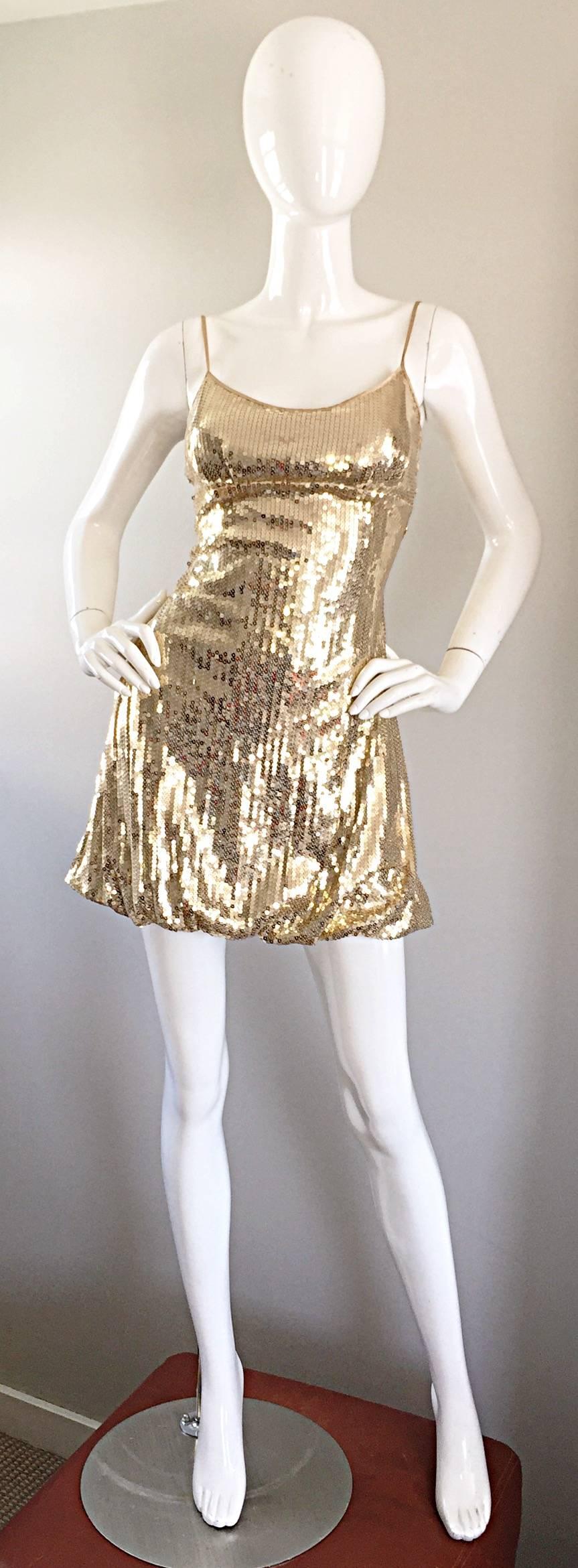 Sexy 90s gold sequined vintage mini bubble dress! Flattering body hugging fit, with a fitted bodice and bubble hem. Hidden zipper up the back, and fully lined. Thin silk spaghetti straps at each shoulder can be lengthened. Looks great alone or