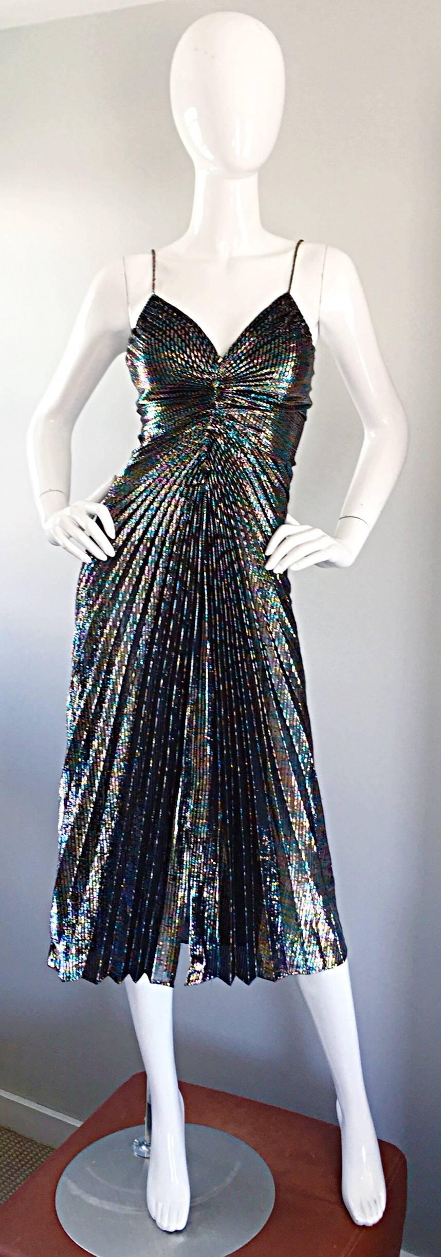 Sexy 1970s SAMIR rainbow metallic pleated dress! Super flattering fit, with a fitted pleated bodice, and flirty pleated skirt. Mock fabric covered buttons up the bodice. Hidden zipper up the back. This is the ULTIMATE party dress, and looks great