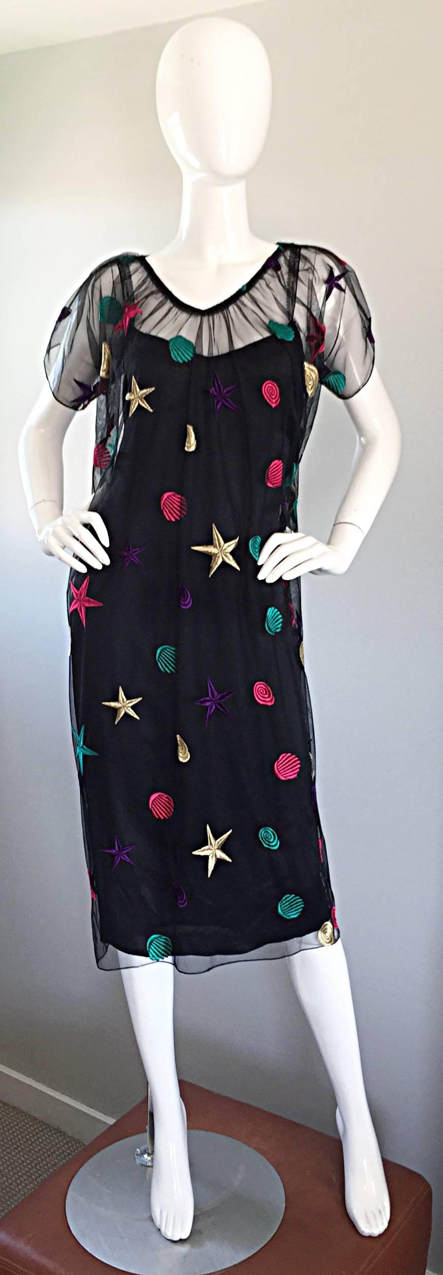 Rare vintage HOLLY'S HARP silk dress and silk mesh overlay! Features a plain black silk slip dress with lace sleeve straps that spell out Holly's Harp. Incredible black silk mesh overlay features embroidered stars and seashells in green, purple,