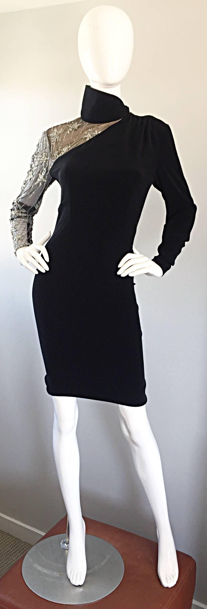 Sexy vintage BOB MACKIE 1990s / 90s  black Avant Garde bodycon dress as seen on MILEY CYRUS ! Tailored body hugging fit, with one nude illusion sleeve that features silver hand-sewn sequins in the shape of shooting stars. Tailored long black sleeve