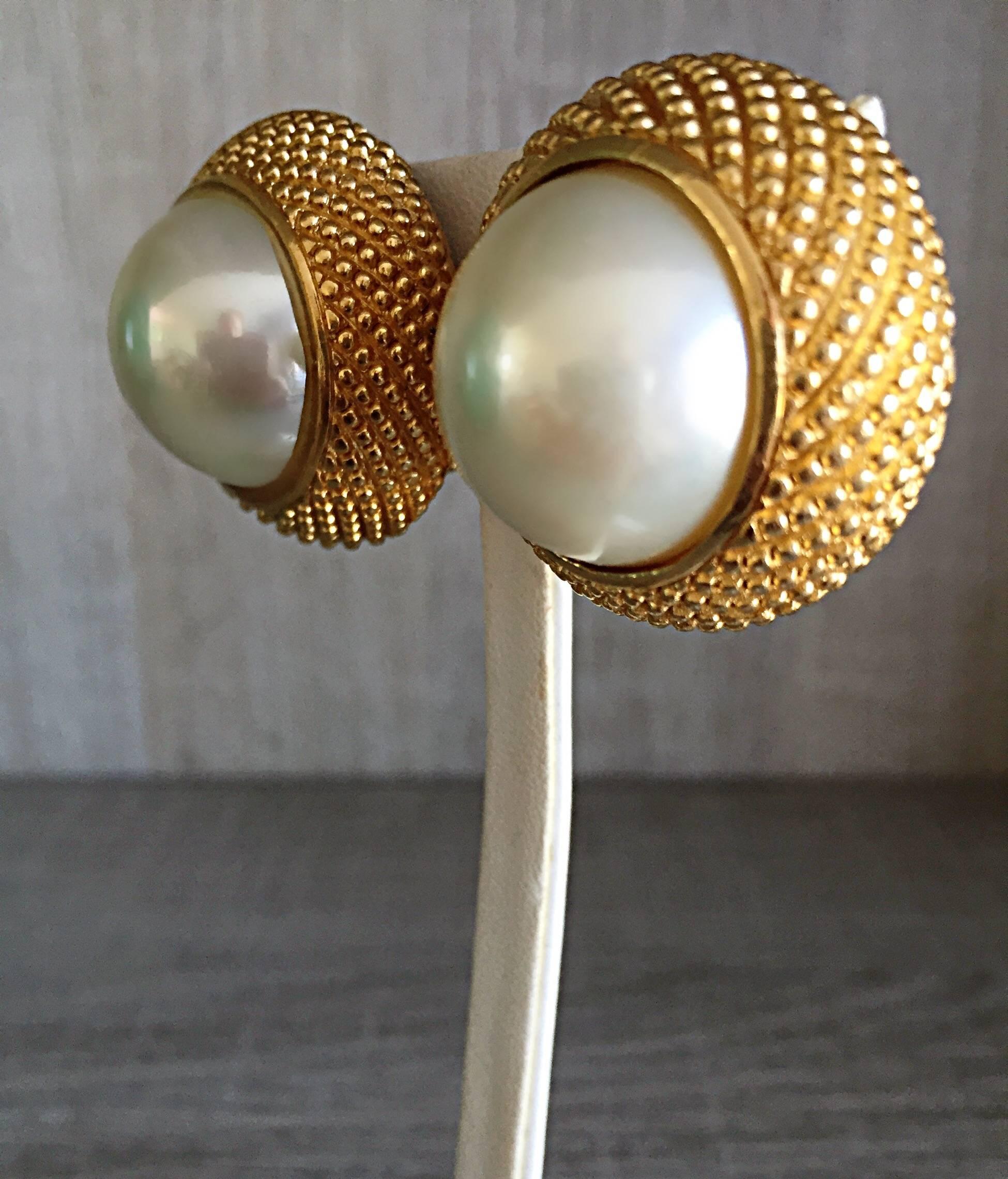 Incredible classic vintage 1990s CHRISTIAN DIOR oversized jumbo domed pearl and gold etched clip on earrings! The perfect match to a suit, jeans, or a dress. Can easily be dressed up or down. Would look fantastic with a Chanel suit! In great