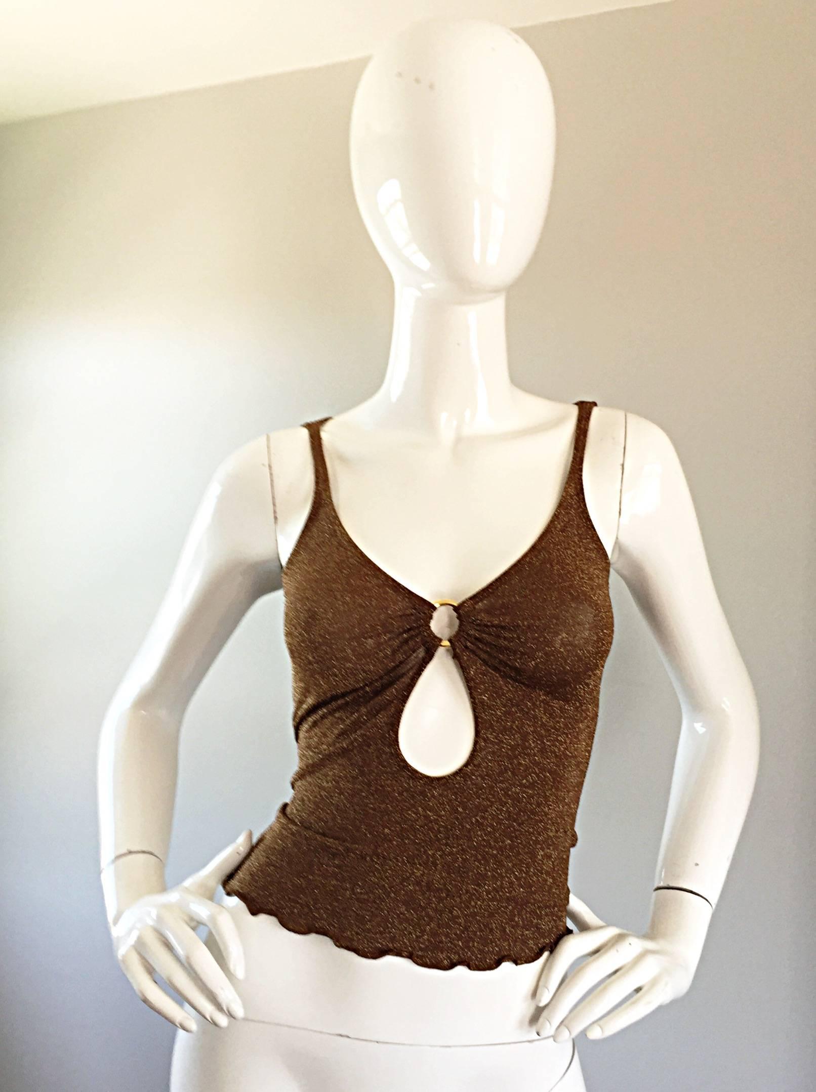 Sexy vintage MOSCHINO bronze metallic crop top! Body hugging fit with a keyhole and gold ring at bust. Scalloped hem. Looks amazing on. Perfect with shorts, jeans, trousers or a skirt. Can easily be dressed up or down. In great condition. Made in
