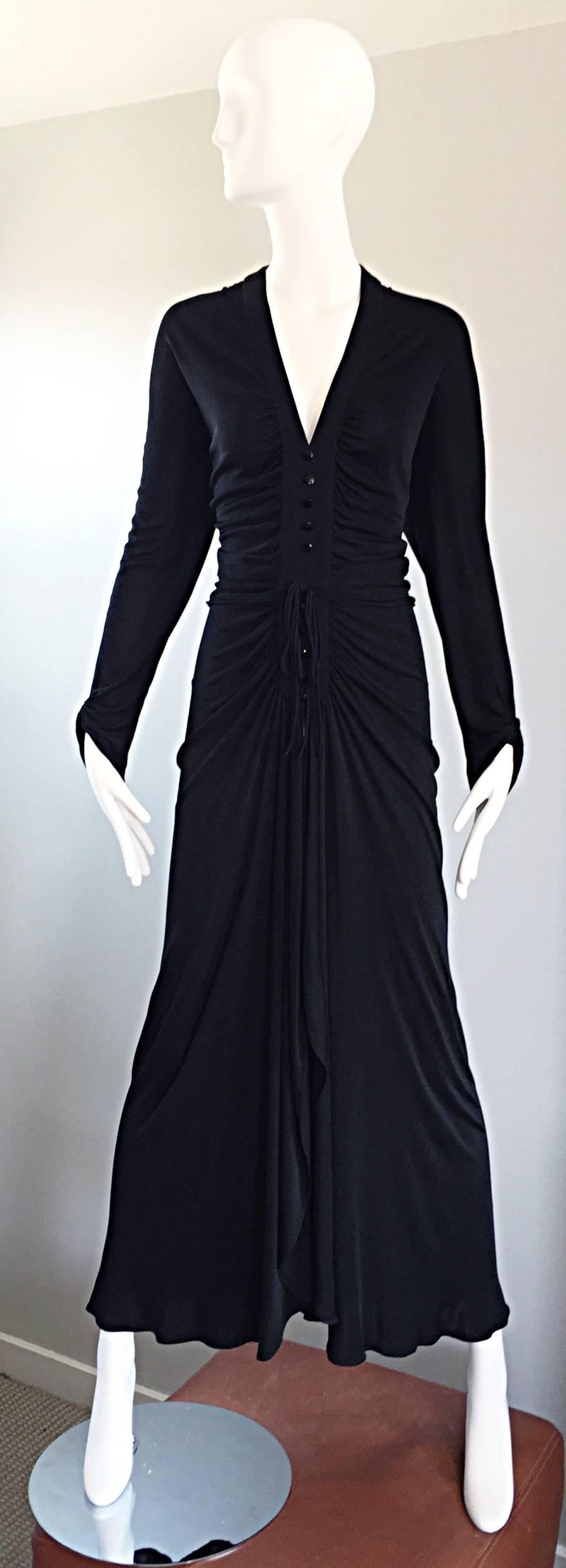 Sensation vintage 70s NINA RICCI black jersey long sleeve belted full length evening dress! Words cannot even begin to describe how utterly beautiful this gown is, and how flattering it is on the body! Demi Couture, with a significant amount of