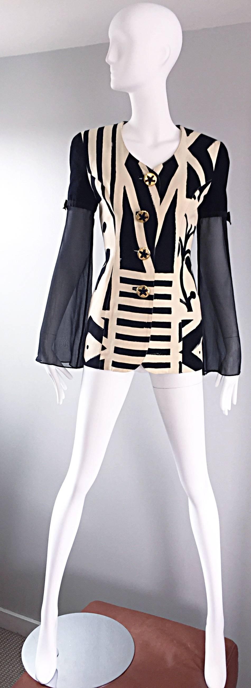 Amazing vintage 90s GEMMA KAHNG black and white Avant Garde blazer jacket! Wonderful tailored fit with impressive abstract prints. Oversized decorative gold buttons up the bodice. Semi sheer black silk chiffon angel sleeves, adorned with a chic