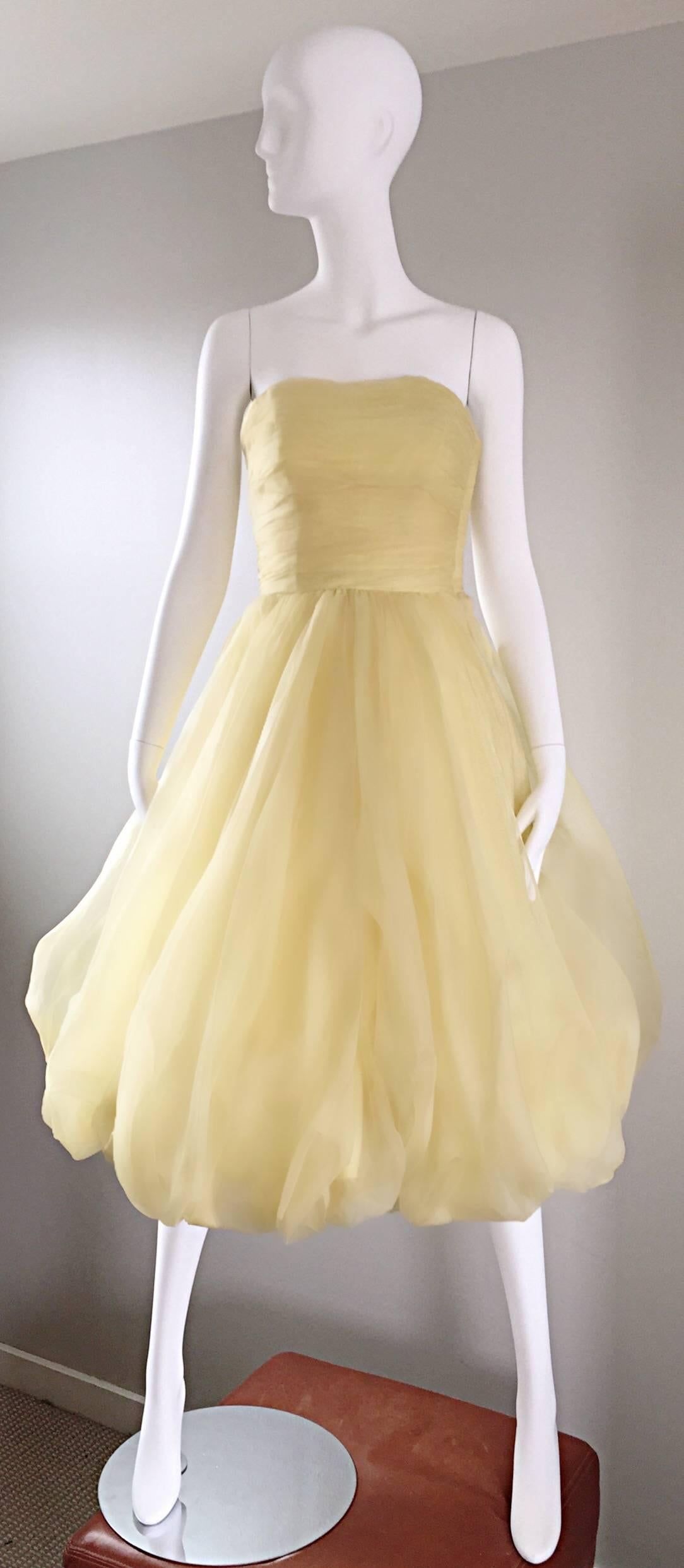Amazing 1950s light canary yellow silk chiffon demi couture strapless cocktail bubble dress! So much detail is featured on this gem! Flattering tailored pleated  boned bodice with an incredible full bubble skirt (attached crinoline). Yellow Silk