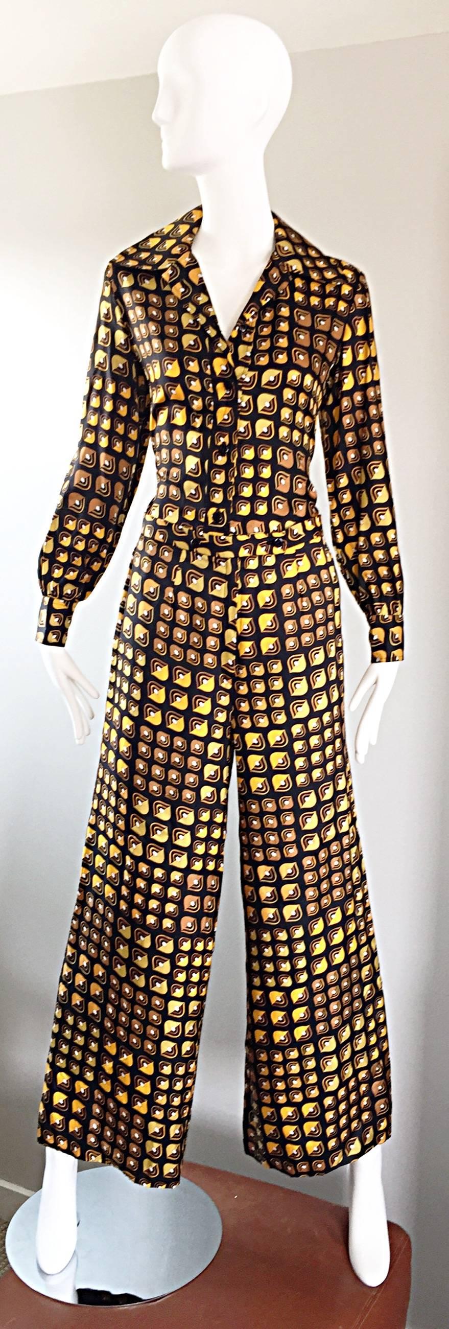 Exceptional and rare vintage 70s LANVIN silk top and pants set! Wonderful yellow, brown, black, and amber geometric 3-D print throughout. Fitted blouse with signature wide lapels, and two pockets on each side of the bottom hem. Buttons up center