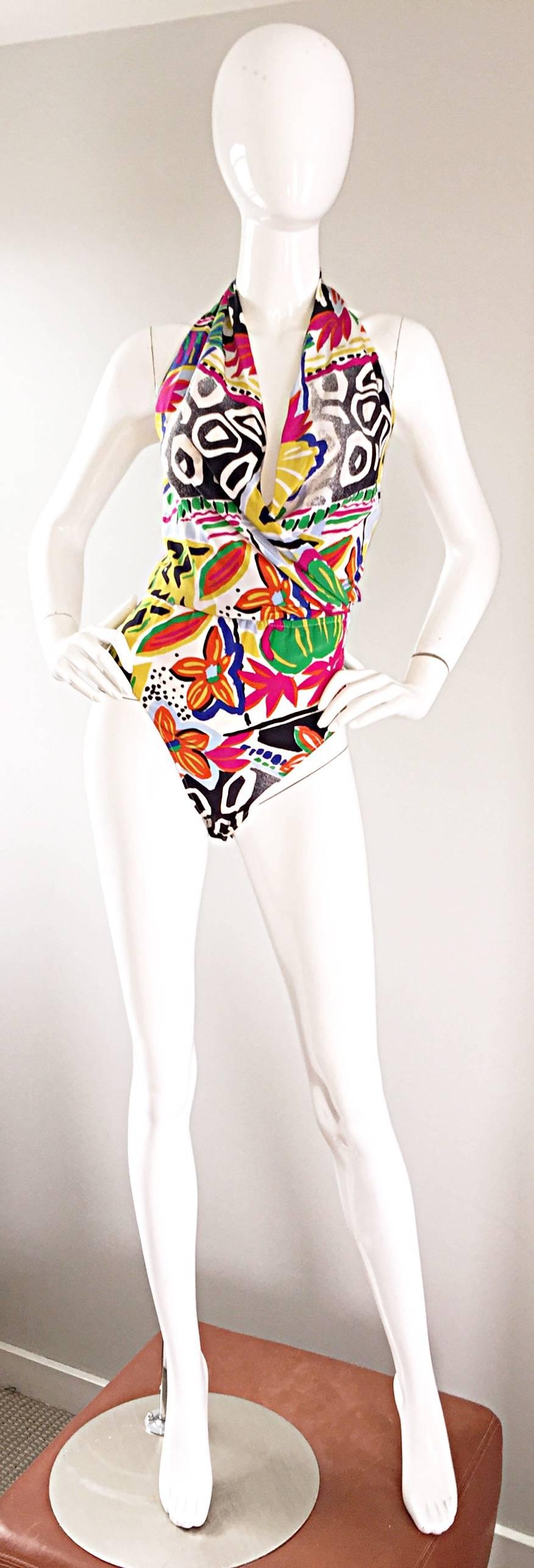 Sexy vintage never worn 90s ESCADA by MARGAREHTA LEY 100% silk bodysuit! Features an amazing print of flowers, geometrics, etc. in vibrant hues of pink, orange, green, blue, yellow, black and white! Flattering plunge neckline. Four snaps at crotch