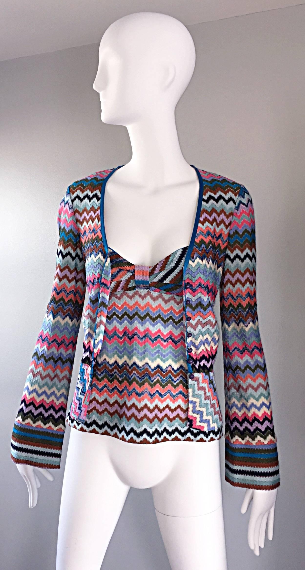 Amazing vintage 1990s MISSONI twinset! Signature cheveron Missoni zig zag in pinks, blues and white. Beautiful round blue lucite buttons up the tailored cardigan. Chic angel bell sleeves. Sexy marching sleeveless top. Bot pieces great together or as