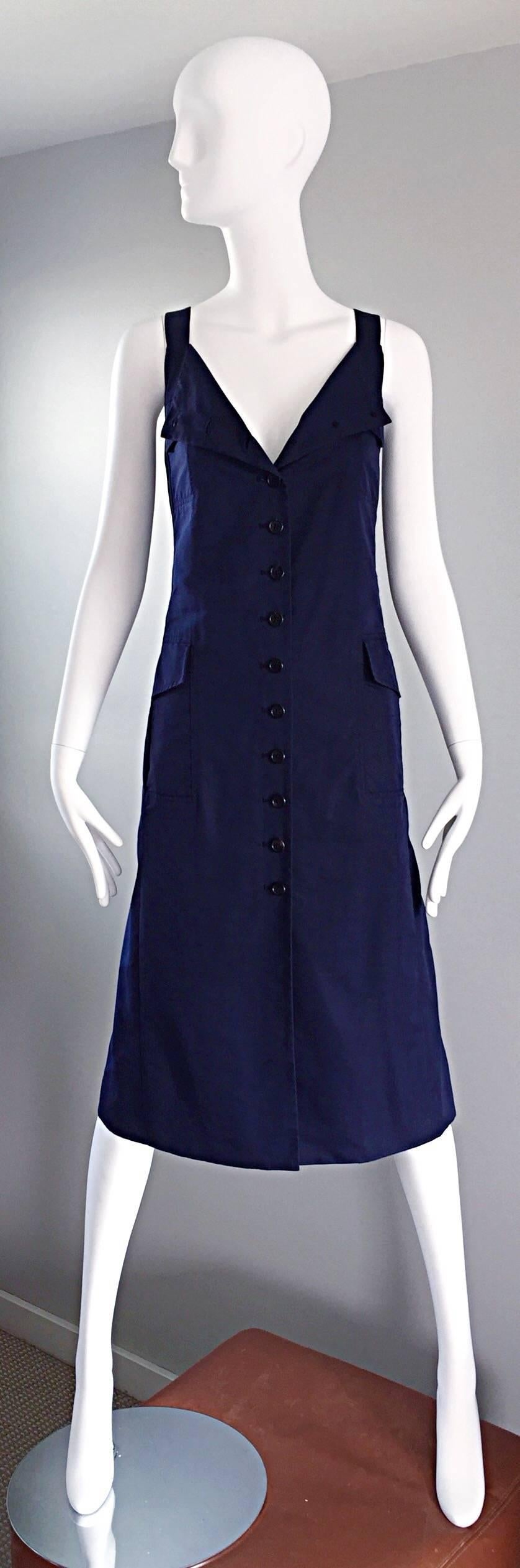 A rare early MARC JACOBS navy blue runway early 90s parachute cargo dress! Features functional buttons all the way up the front of the dress. Can be worn all the way buttoned up, or left partially open. Four cargo pockets on the front. Parachute