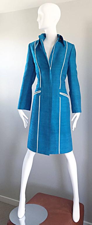 Striking vintage 90s MAX NUGAS HAUTE COUTURE Cerulean teal blue and white raw silk shantung trench style jacket / coat ! Features the finest of rich Cerulian blue silk shantung with white silk piping and details. Pockets at each side of the waist