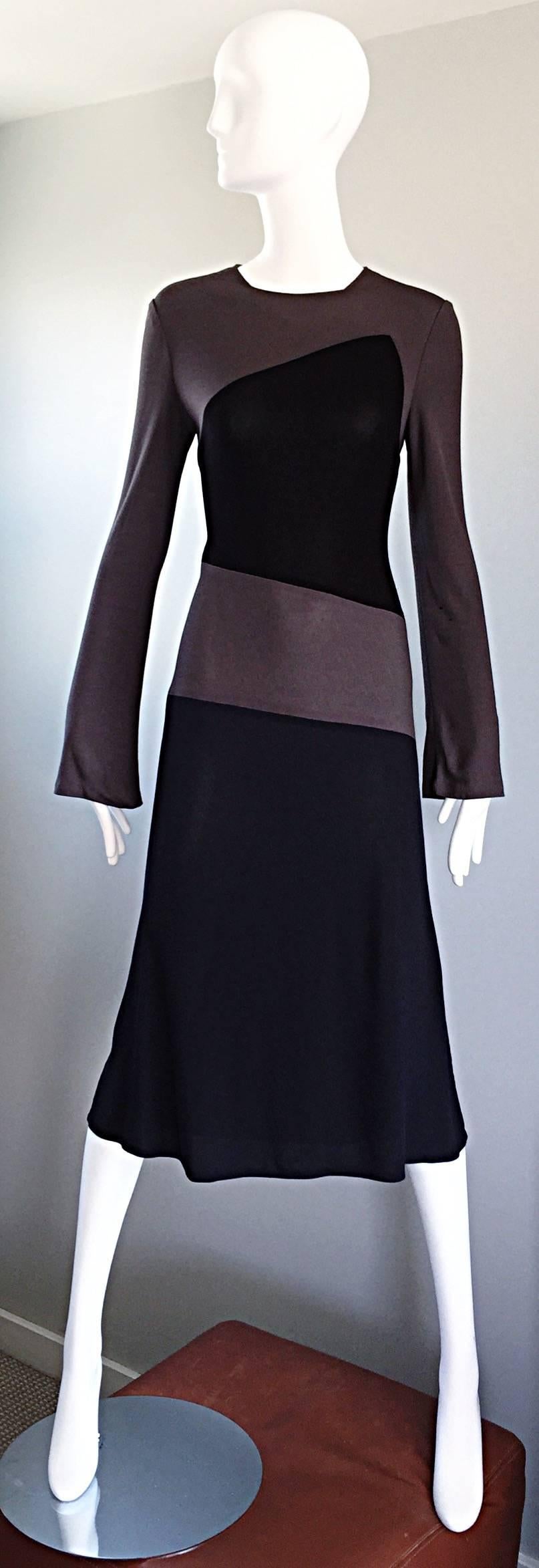 Amazing vintage 90s CALVIN KLEIN COLLECTION black and taupe gray colorblock Avant Garde dress! Amazing double layered silk jersey fabric clings to the body perfectly! Tailor fitted bell sleeves. Hidden zipper up the side with hook-and-eye closure.