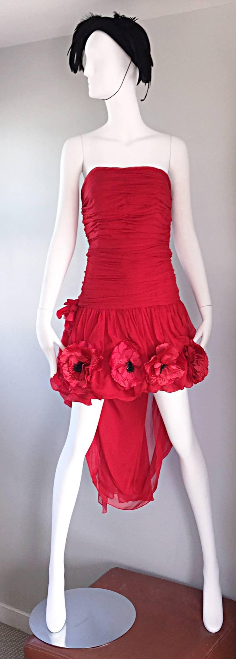 Vintage CHRISTIAN LACROIX red silk chiffon Hi-Lo strapless cocktail dress! Features a ruched fitted boned bodice, with a flirty chiffon skirt. Bead encrusted poppy flowers are sewn onto the hem of the skirt on the front and back. Self tying sash at