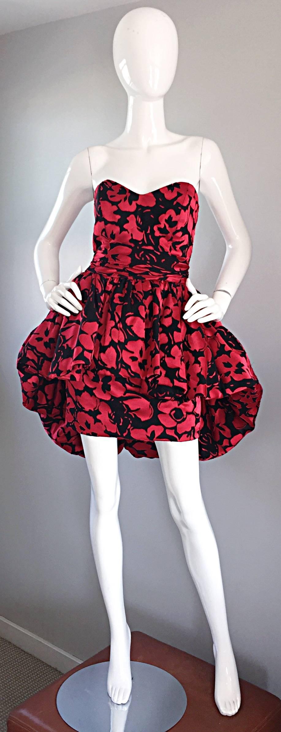 Sensational vintage CHRISTIAN LACROIX Couture black and red silk strapless cocktail mini dress! Features a fitted boned bodice. Flattering fitted mini skirt with a hand-sewn Avant Garde oversized peplum. Mostly hand-sewn with heavy attention to