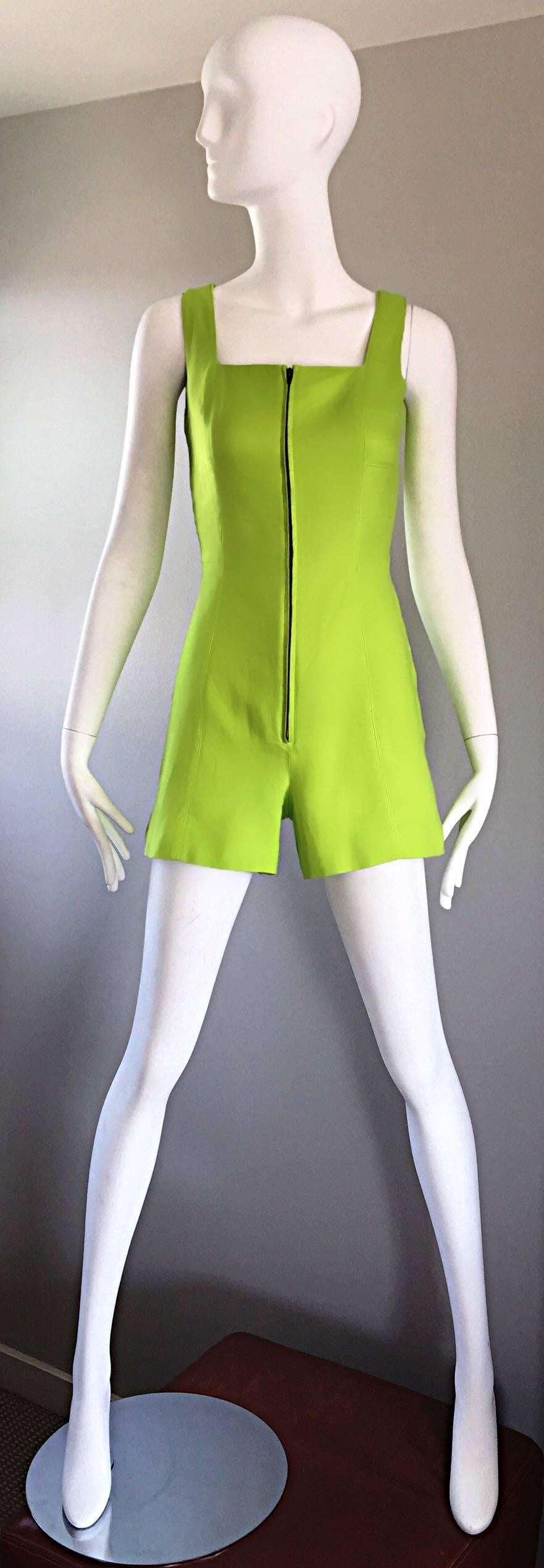 Extraordinary and super rare chic vintage CLAUDE MONTANA early 1990s / 90s one piece romper / playsuit / jumpsuit! Electric neon lime green color on a soft cotton and linen blend. Full metal zipper up the front bodice. Super flattering fit that