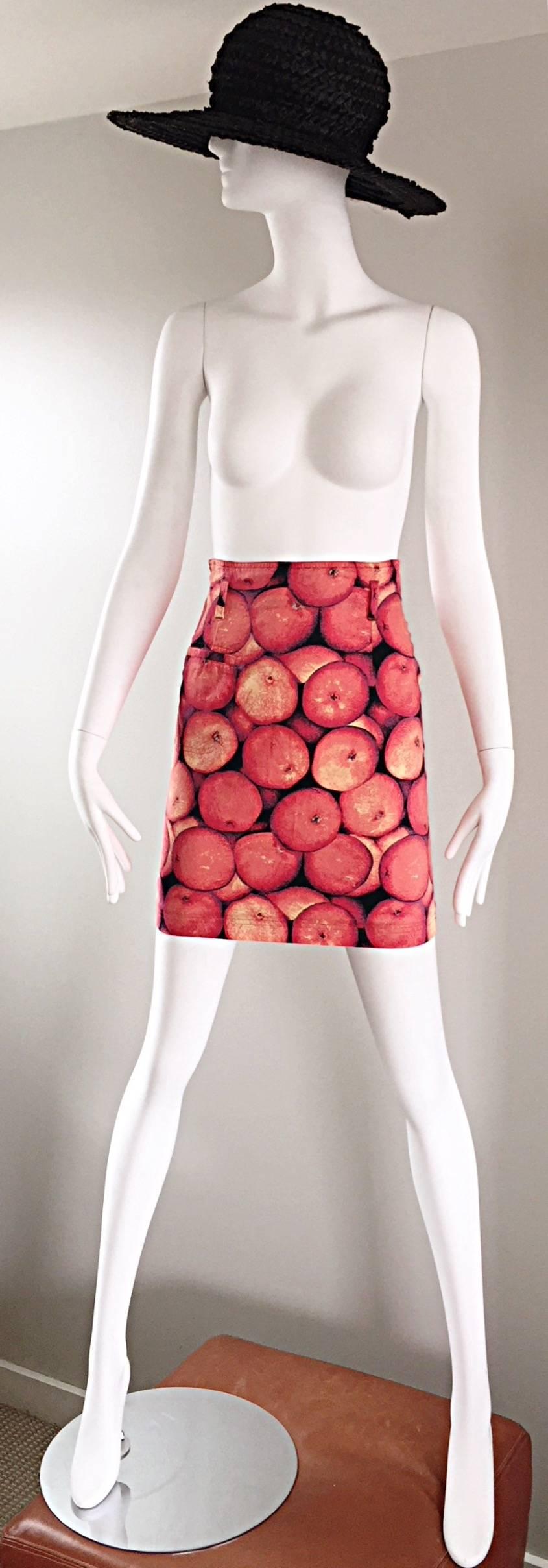 AMazing vintage MONDI high waisted 90s 'oranges' novelty mini skirt! Features an allover print of three dimensional oranges (the fruit). Flattering high-waisted fit with a Bodycon fit. Pocket at right hip. Can be worn belted or alone. Hidden zipper