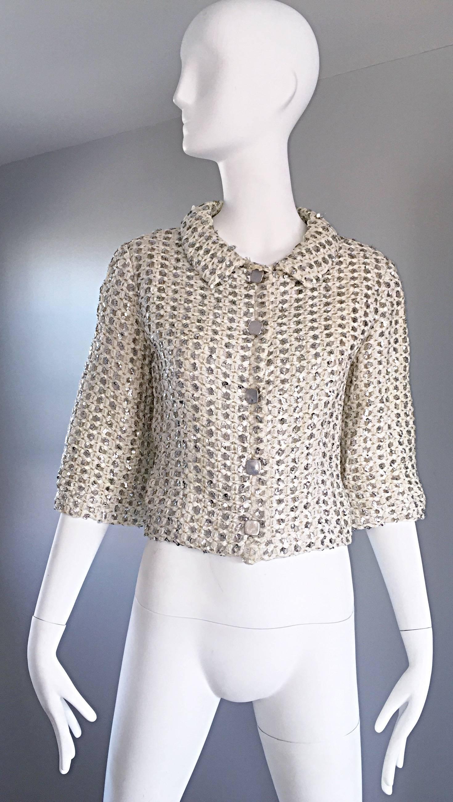 Chic vintage TEAL TRAINA by GEOFFREY BEENE early 60s silk Ivory ribbon and silver sequined cropped swing jacket! Beene was the head designer for Traina from 1958-1963, before starting his own label. Hand painted silver metallic buttons down the