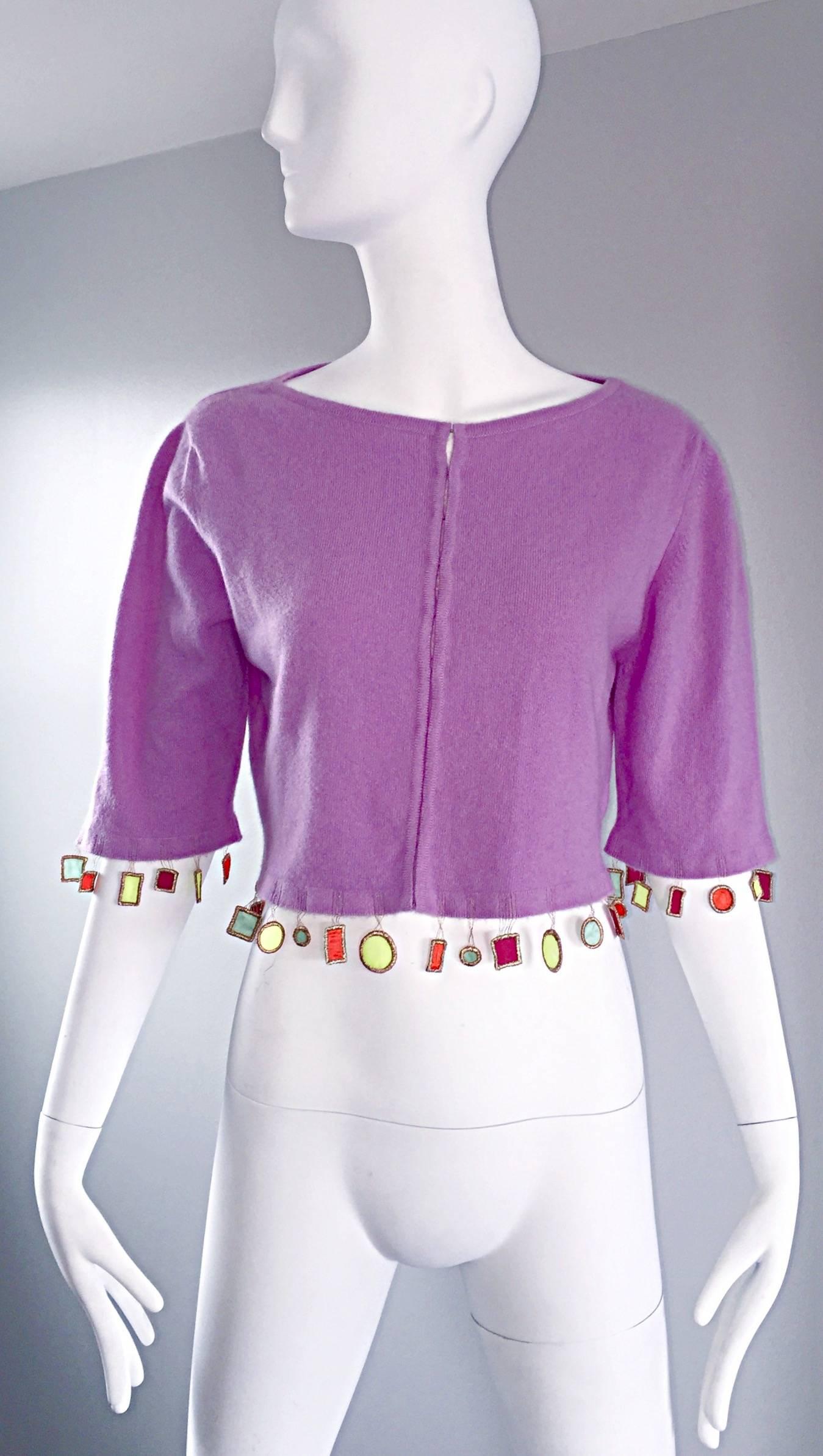 Whimsical MATTHEW WILLIAMSON lilac light purple cashmere cardigan sweater! Luxurious Scotish cashmere feels amazing against the skin! Neon appliqués along the front and back hem, and at the sleeve cuffs. Hook-and-eye closure up the bodice. The