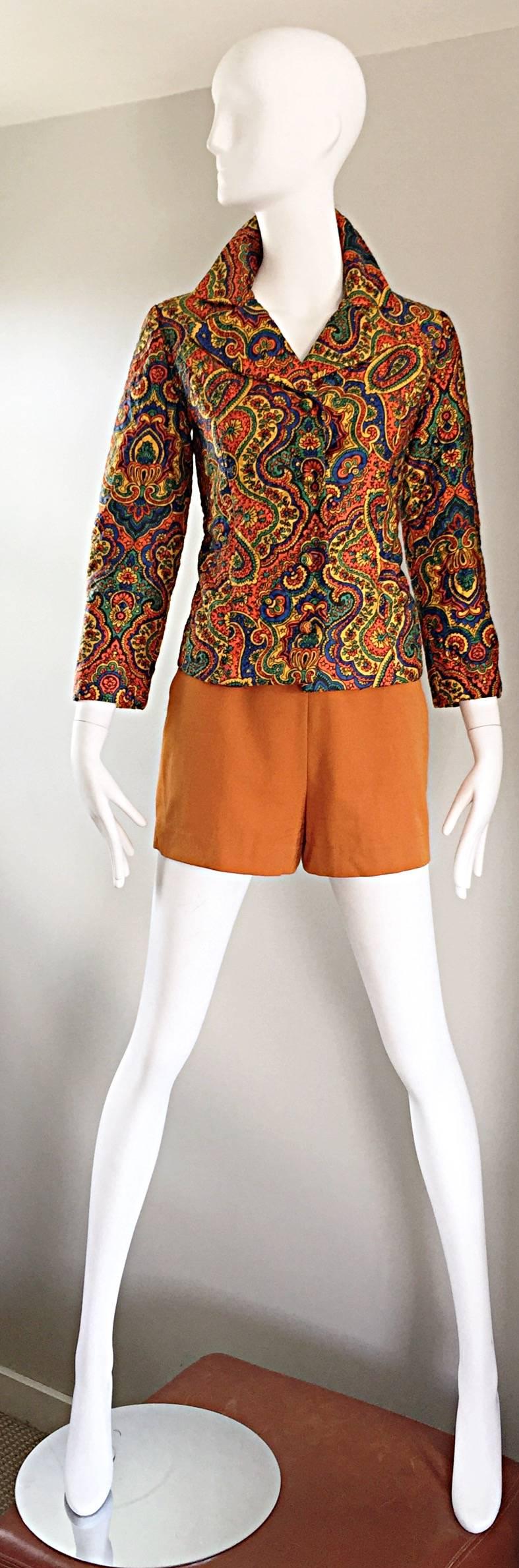 Rare and totally awesome 60s vintage WIPPETTE cotton blazer jacket! Features an allover paisley print in green, orange, yellow, and blue. The perfect statement piece! Soft heavy duty cotton keeps shape nicely. Fabric covered ball buttons up the