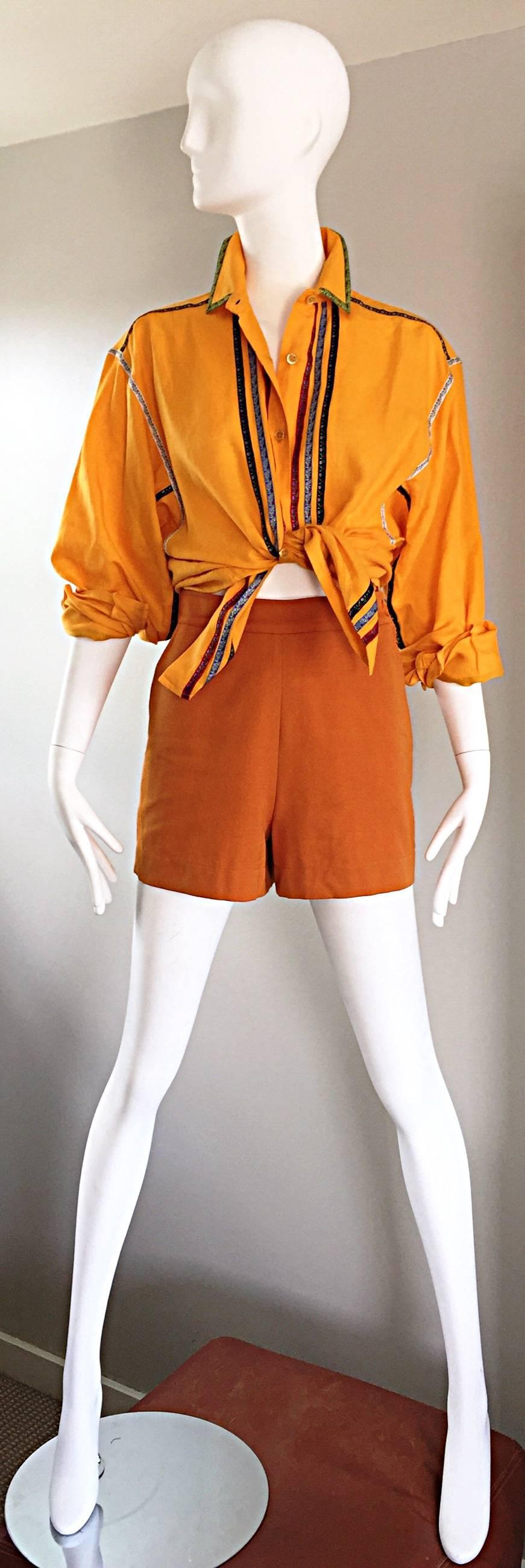 Wonderful vintage KENZO 90s marigold yellow cotton and linen long sleeve dolman blouse! Vibrant marigold color with strips of embroidered flower ribbons throughout. Buttons up the bodice, and at each sleeve cuff. Chic dolman sleeves make this gem