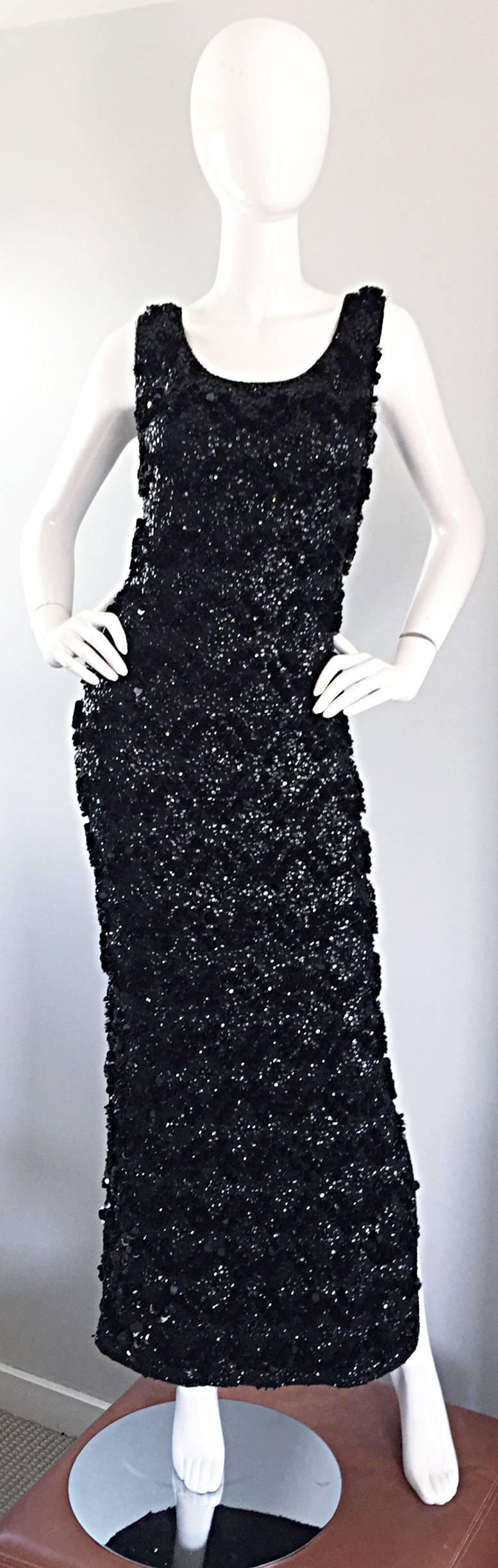 Breathtaking 1950s black wool knit couture fully sequined and paillete full length evening wiggle dress! This gem was made in Hong Kong, with the sought-after 