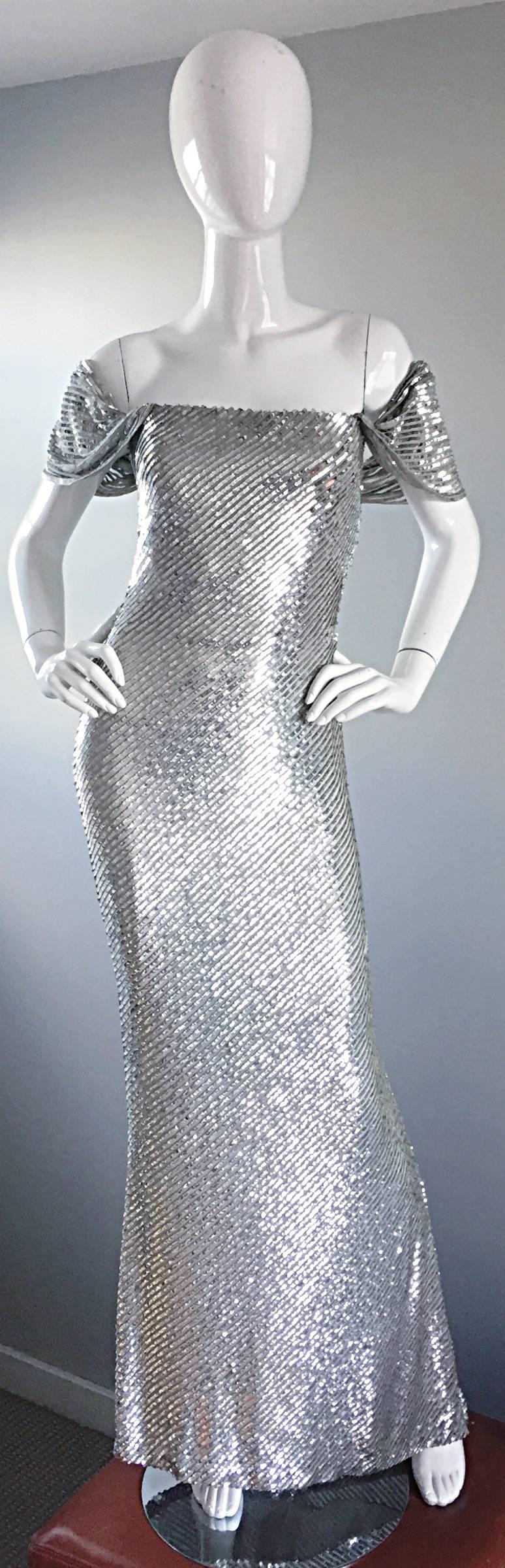 Spectacular bran new (with original price tag of $7,250) vintage BILL BLASS Couture fully sequined silver evening dress! Would cost well over $15,000 today! Features thousands of hand-sewn silver sequins throughout the entire gown. Interior support