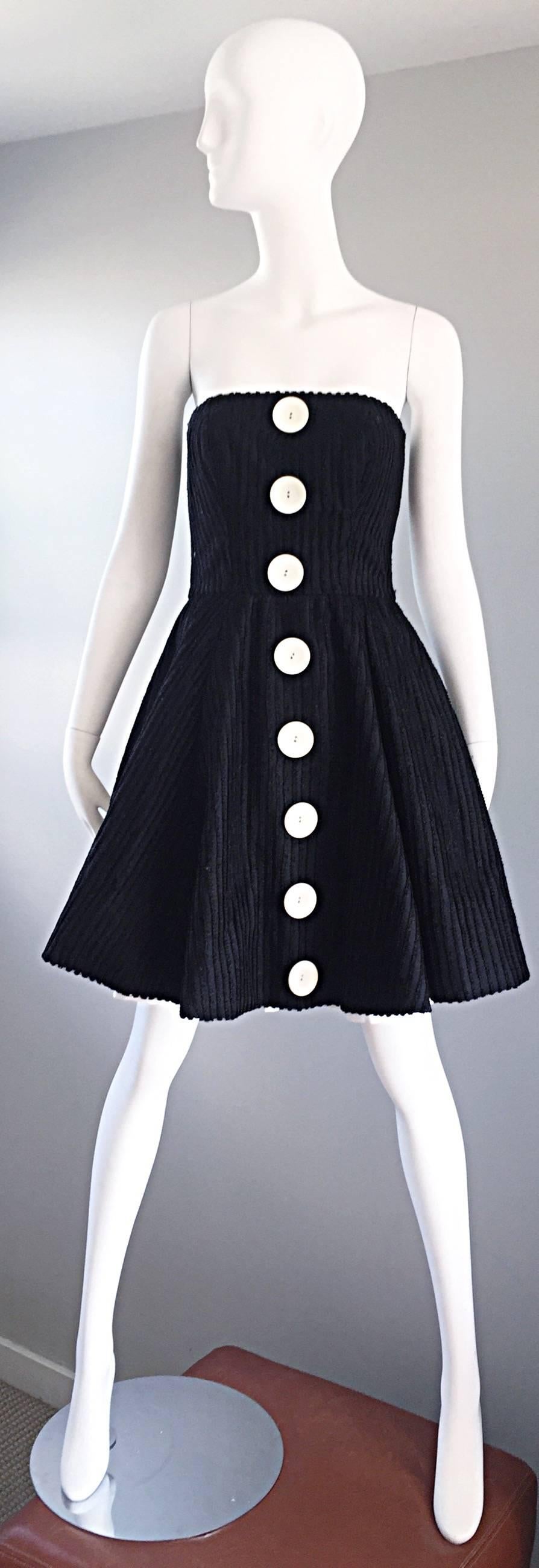 Sensational 1990s vintage CHRISTIAN LACROIX Couture black and white dress! Features a black silk and cotton netting throughout. Five oversized mock buttons up the front. Built in interior support to keep everything in place. Hidden zipper up the