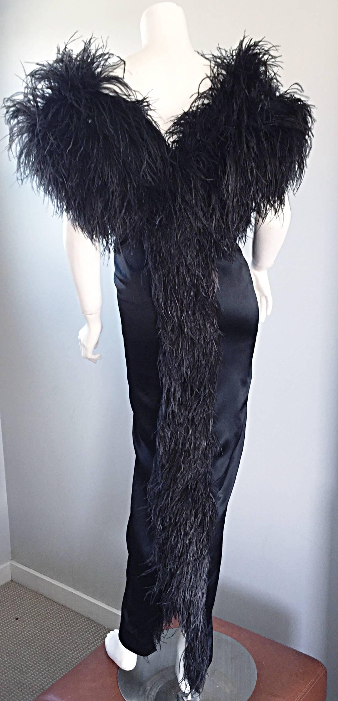 Sensational and rare vintage 1970s HOLLY'S HARP black silk evening dress! Dramatic black ostrich feathers around the bust, and down the center back! Luxurious layers of 'liquid silk' drapes over the body in all the right places, and looks smashing