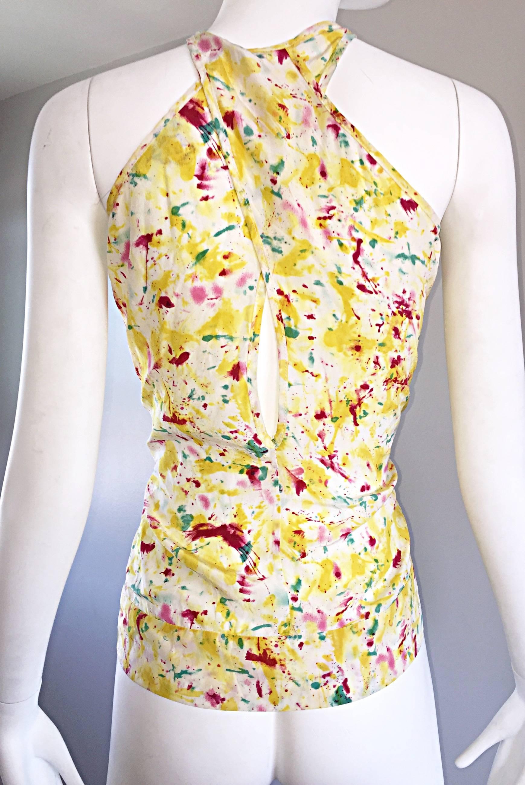 Chic 90s vintage EMILIO PUCCI silk sleeveless top from the 'Splatter Paint' Collection! Ivory white background with vibrant pink, yellow, green, and teal throughout. Peek-a-boo slit at criss-cross back. Flattering fit that looks fantastic slouchy or