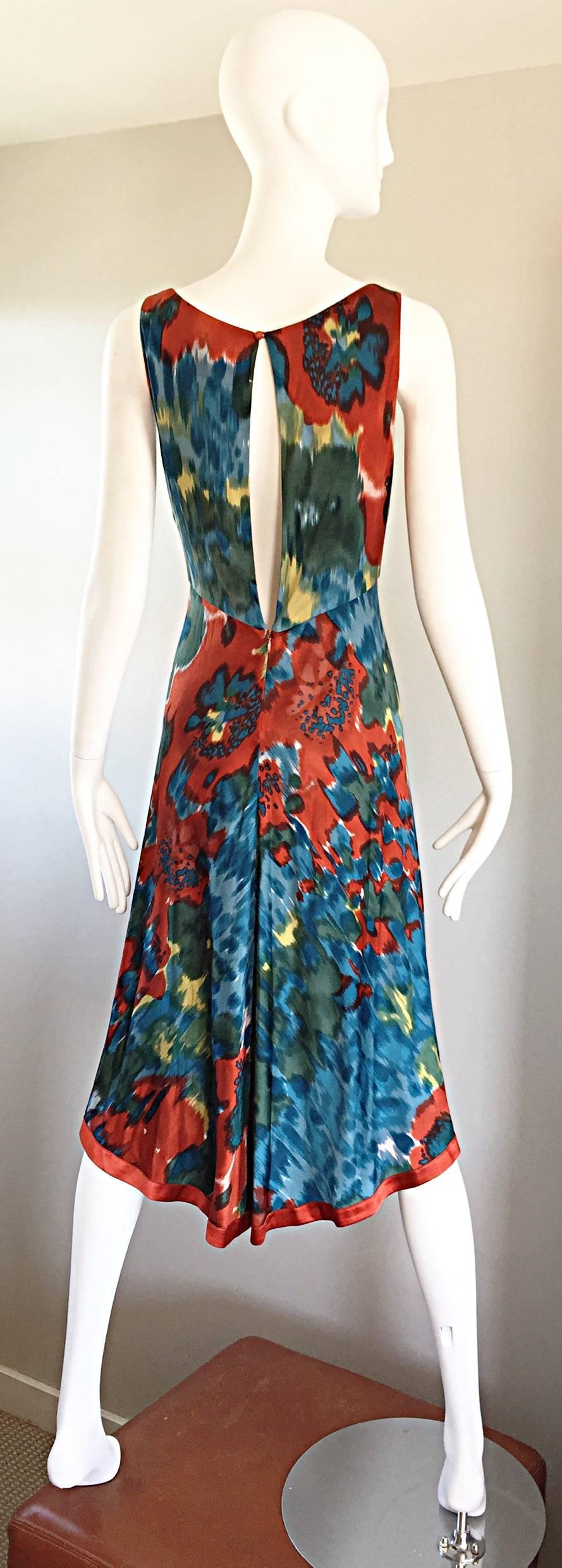 Wonderful brand new (from Barney's) YIGAL AZROUEL boho jersey dress! Warm hues of blue, burnt orange, green, and lime green in a brilliant watercolor  print. Peek-a-boo slit on the back reveals just the right amount of skin. Soft silk and rayon