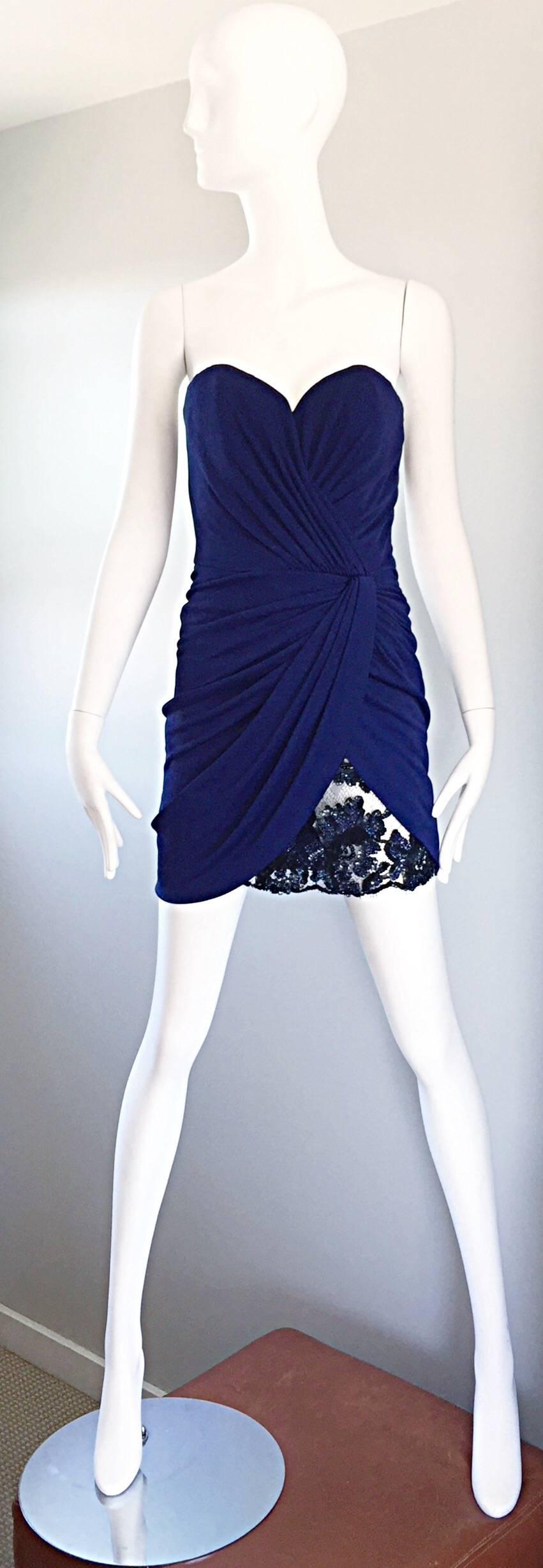 Sexy vintage VIKY TIEL COUTURE 1990s / 90s navy blue ruched strapless mini jersey dress! Features flattering ruching throughout the front. Navy blue French Chantilly lace and sequined peek-a-boo at left hem. Sweetheart bust looks amazing on! Amazing